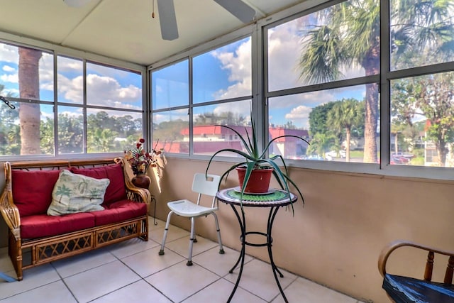 sunroom featuring ceiling fan and a wealth of natural light