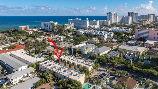 birds eye view of property featuring a water view