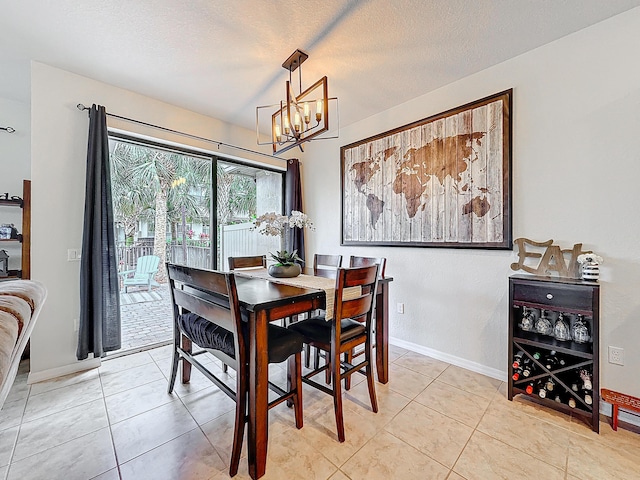 tiled dining area with an inviting chandelier and a textured ceiling