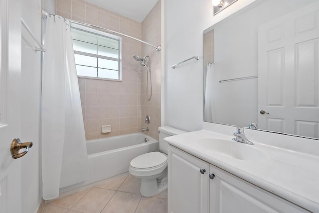 bathroom featuring vanity, shower / bath combo with shower curtain, tile patterned flooring, and toilet