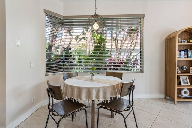 dining area featuring baseboards and light tile patterned floors