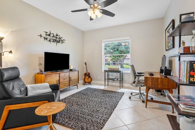 office with light tile patterned floors, ceiling fan, and baseboards