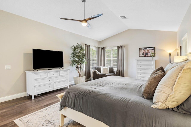 bedroom with wood finished floors, a ceiling fan, visible vents, vaulted ceiling, and baseboards