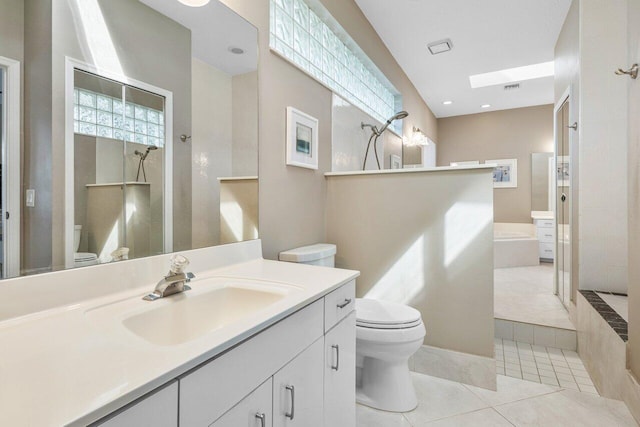 full bath with toilet, vanity, tile patterned flooring, walk in shower, and a bath