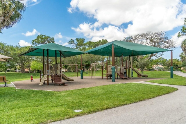 communal playground featuring a lawn