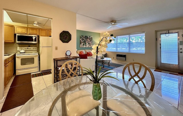 dining room featuring light tile patterned floors and ceiling fan