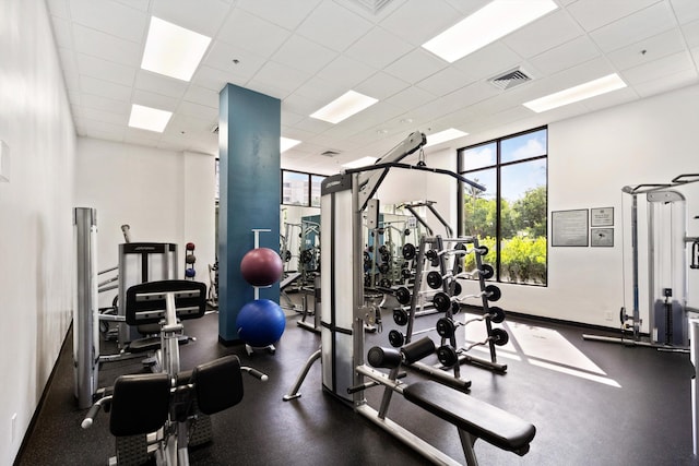 exercise room featuring a drop ceiling