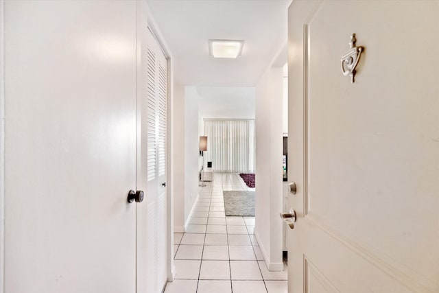 hallway featuring light tile patterned floors