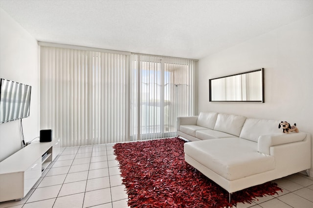 living room with light tile patterned floors and a textured ceiling