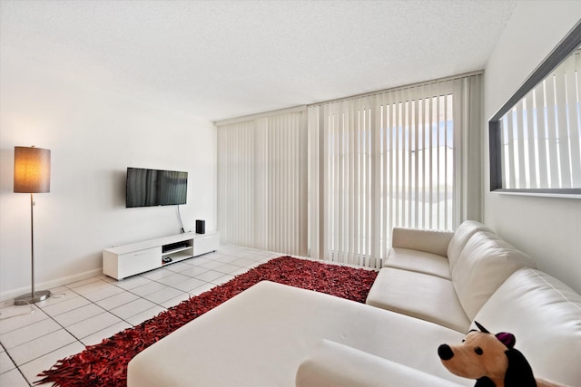 living room with light tile patterned floors and a textured ceiling