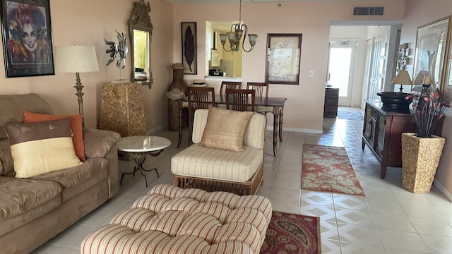 14623 Bonaire Blvd Unit 605, Delray Beach, FL 33446 - living room featuring light tile patterned flooring and baseboards