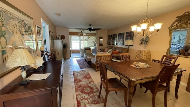 14623 Bonaire Blvd Unit 605, Delray Beach, FL 33446 - dining area featuring ceiling fan, a chandelier, and light tile patterned flooring