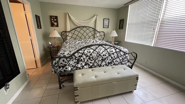 14623 Bonaire Blvd Unit 605, Delray Beach, FL 33446 - bedroom featuring tile patterned flooring and baseboards