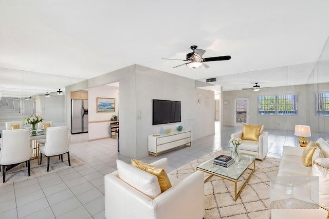 tiled living room with ceiling fan