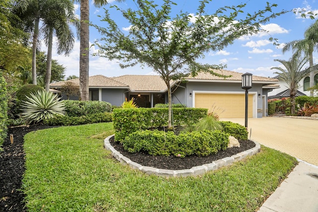 ranch-style house with stucco siding, a tile roof, decorative driveway, and a garage