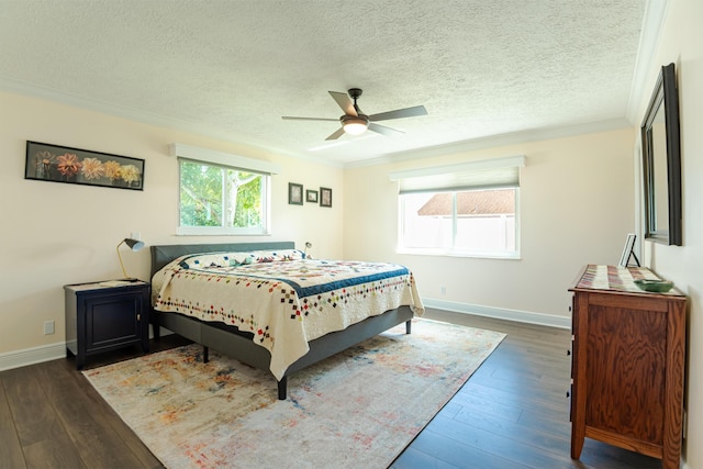 bedroom featuring dark wood-type flooring, crown molding, and multiple windows