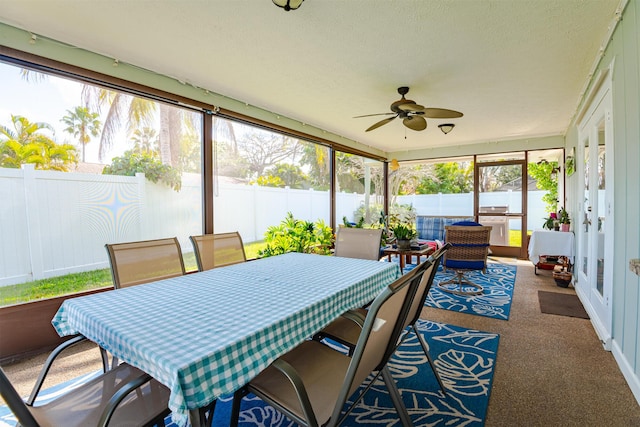 sunroom / solarium with ceiling fan