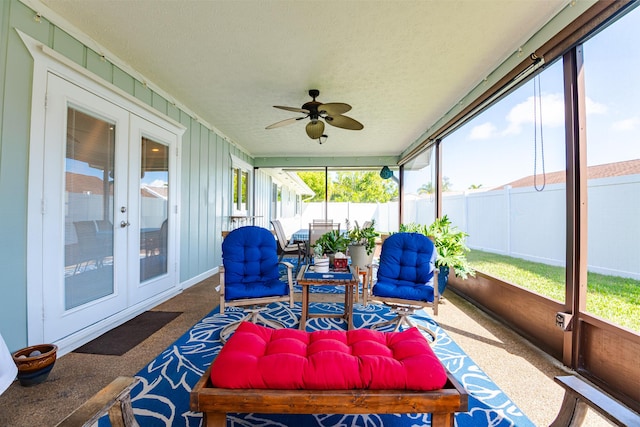 sunroom featuring french doors and ceiling fan