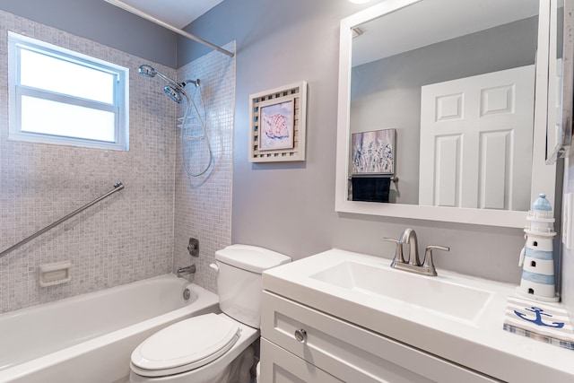 full bathroom featuring vanity, toilet, and tiled shower / bath combo