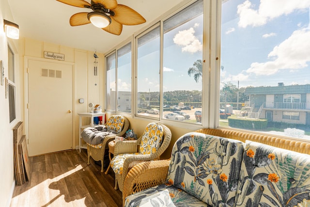 sunroom with a wealth of natural light and ceiling fan