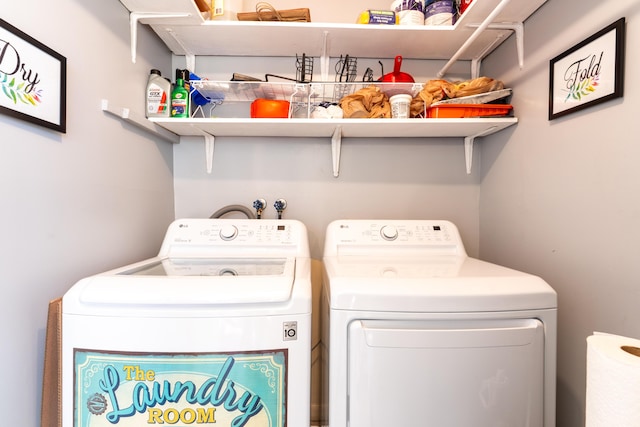 laundry area with washing machine and dryer