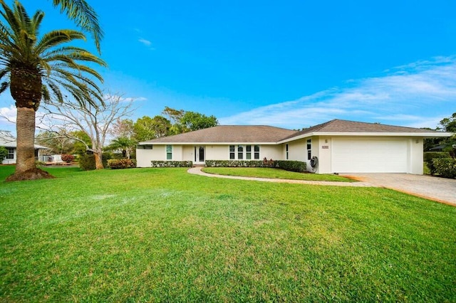 ranch-style house with a garage and a front lawn