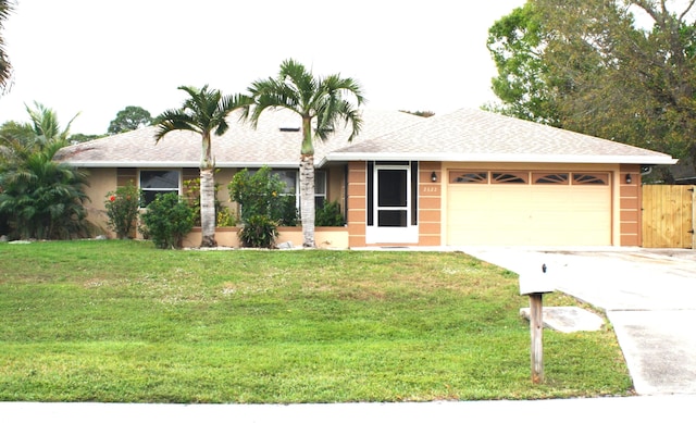 ranch-style home featuring a front lawn and a garage