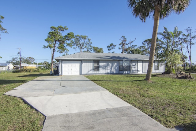 ranch-style house with a garage and a front yard