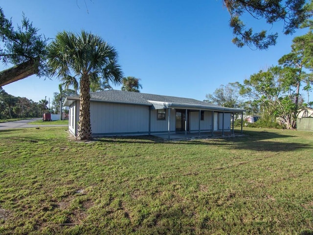 view of front facade with a patio area and a front yard