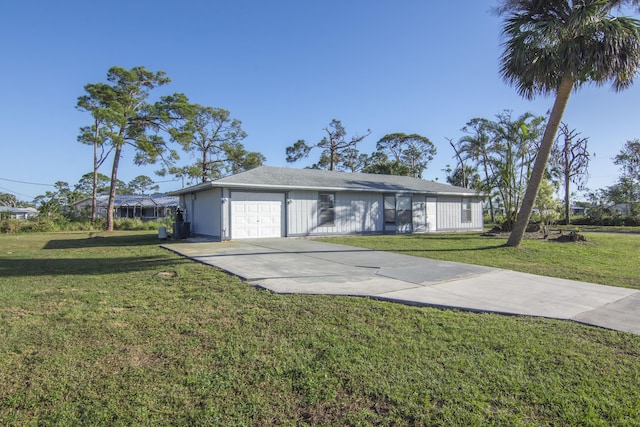 view of front of house with a garage and a front lawn