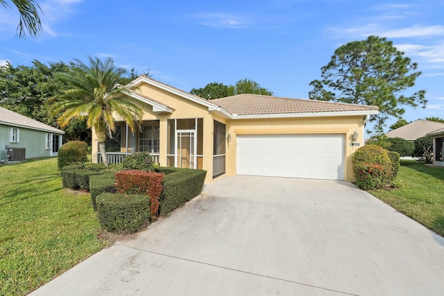 ranch-style home with stucco siding, a front lawn, concrete driveway, a garage, and central AC unit