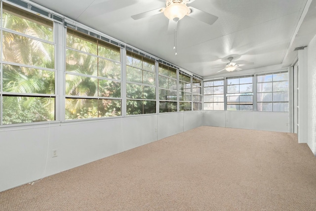 unfurnished sunroom featuring ceiling fan