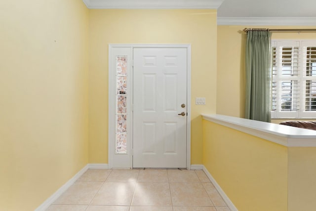 tiled foyer entrance with ornamental molding