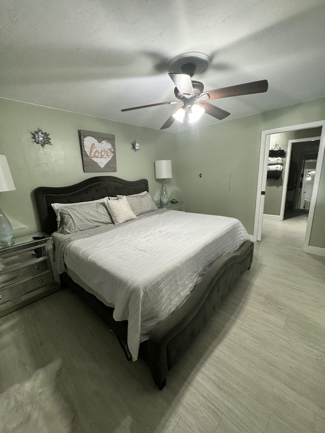 bedroom featuring ceiling fan and light wood-type flooring