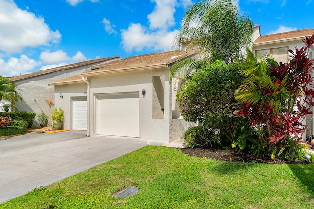 view of front facade with a garage and a front yard