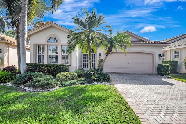 7322 Morocca Lake Dr, Delray Beach, FL 33446 - view of front of home with a garage