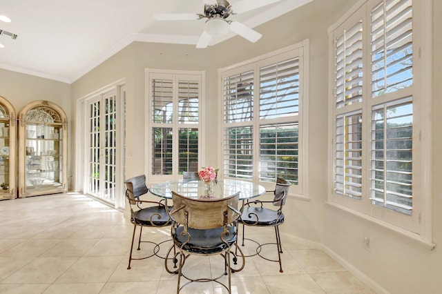 sunroom / solarium featuring ceiling fan