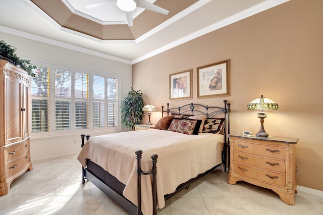 bedroom featuring light tile patterned floors, ornamental molding, a raised ceiling, and ceiling fan