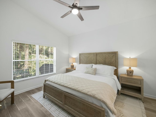 bedroom featuring lofted ceiling, hardwood / wood-style floors, and ceiling fan