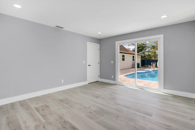 empty room featuring light hardwood / wood-style floors