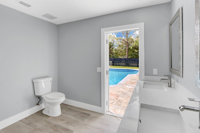 bathroom featuring vanity and toilet