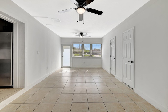 spare room featuring light tile patterned floors