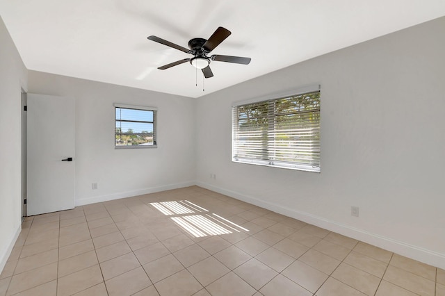 unfurnished room featuring light tile patterned floors and ceiling fan