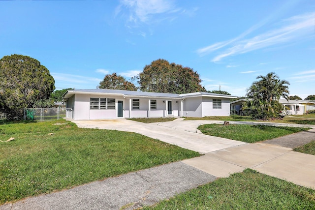 ranch-style home with a front lawn