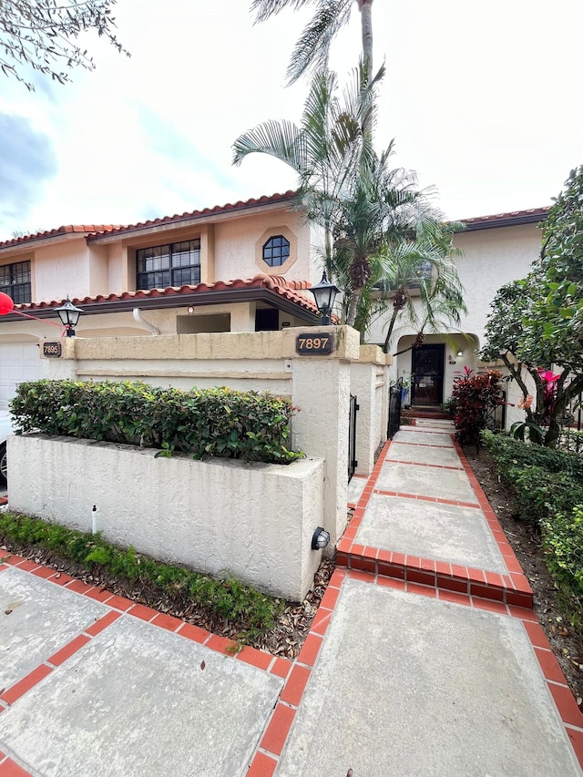 7895 La Mirada Dr, Boca Raton, FL 33433 - view of front of home with a tile roof and stucco siding