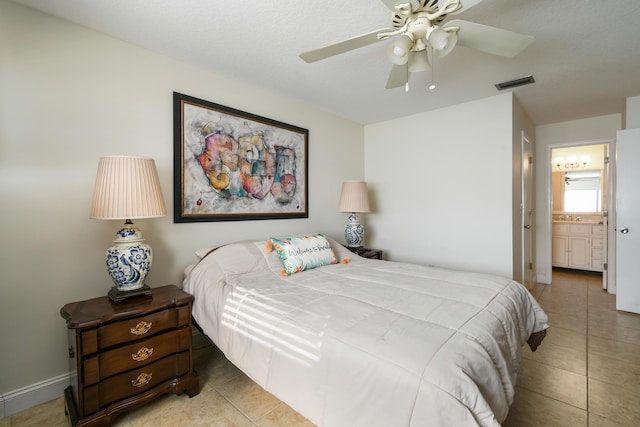 bedroom with light tile patterned floors, ceiling fan, and visible vents