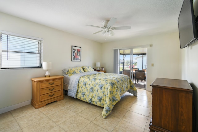 bedroom with baseboards, ceiling fan, access to outside, a textured ceiling, and light tile patterned flooring