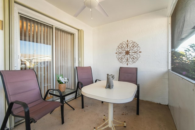 sunroom featuring ceiling fan