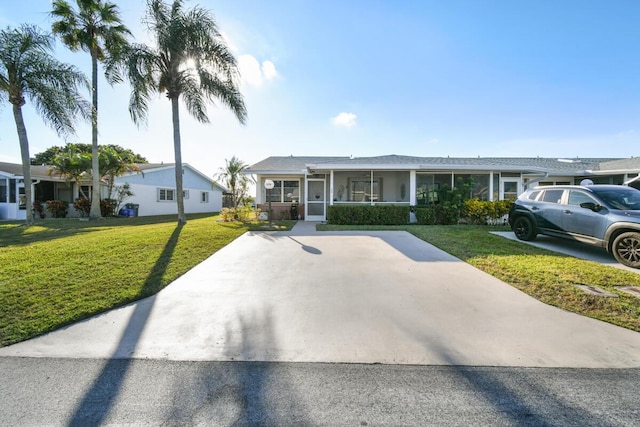 ranch-style home with a porch and a front yard