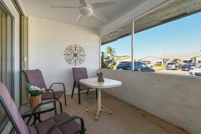 view of patio / terrace featuring a balcony and a ceiling fan